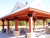 Gotcha Sprayer Pro spraying wasps at a picnic shelter